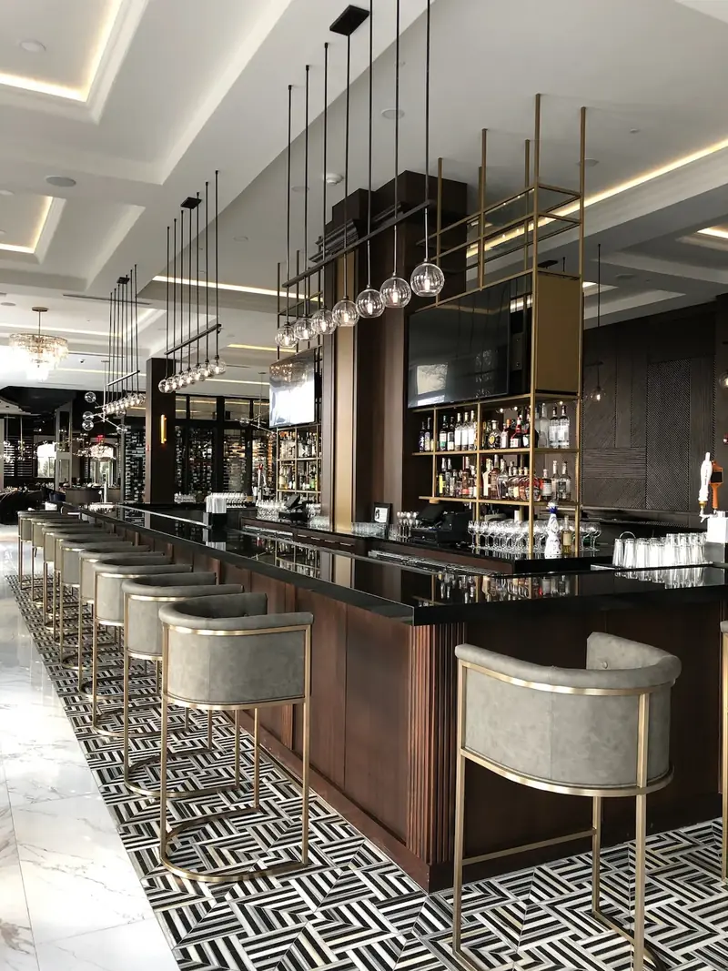 Bar, The Chateau Grande Hotel, East Brunswick, NJ: hotel bar with brass pendant lighting and cove ceiling