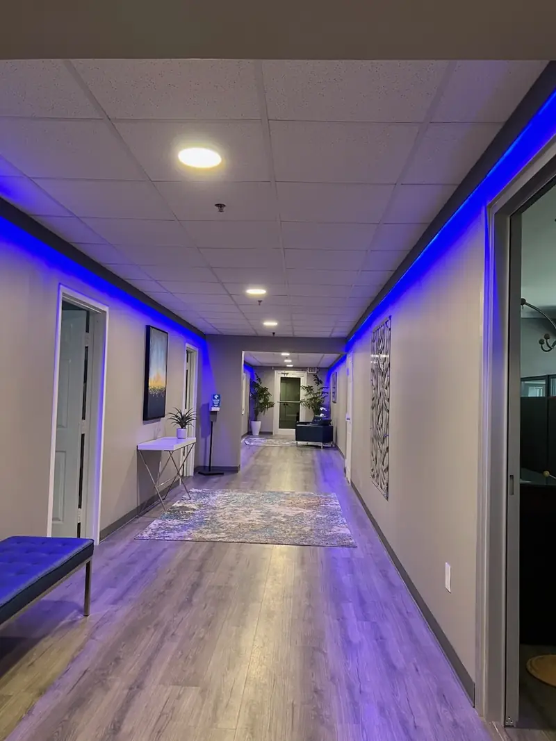 Commend Office Suite, Mahwah, NJ: office corridor with blue cove lighting