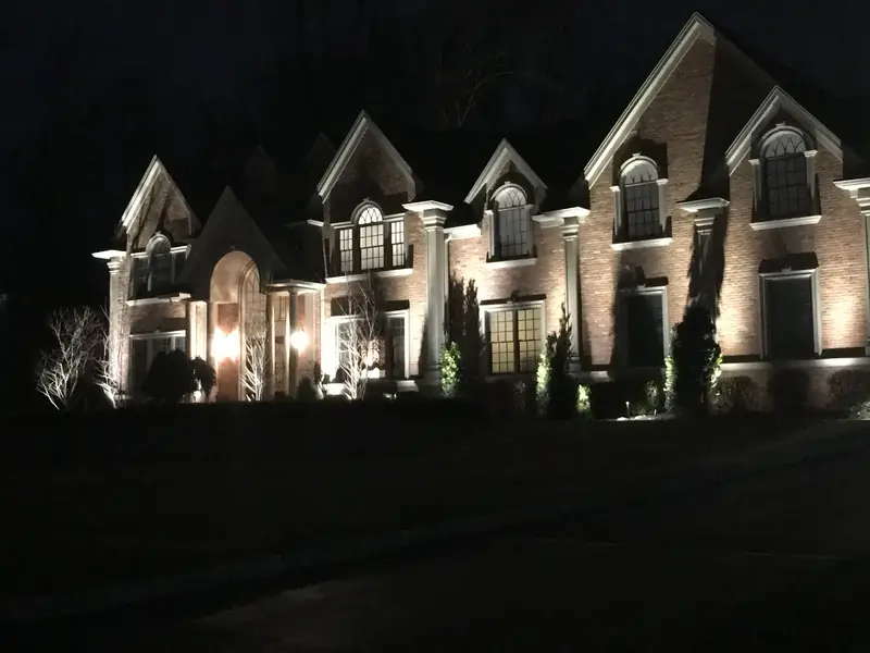 Home Facade, Franklin Lakes, NJ: brick estate facade washed with warm architectural lighting at night