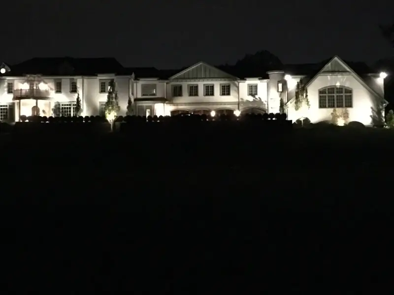 white home facade lighting at night, Montclair, NJ