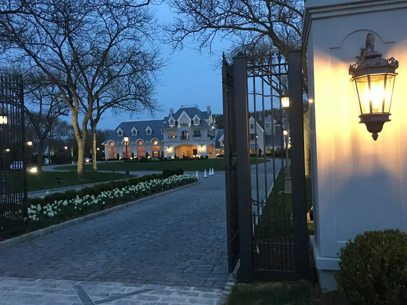 Park Chateau Entry Gate, East Brunswick, NJ: lit entry gate at dusk
